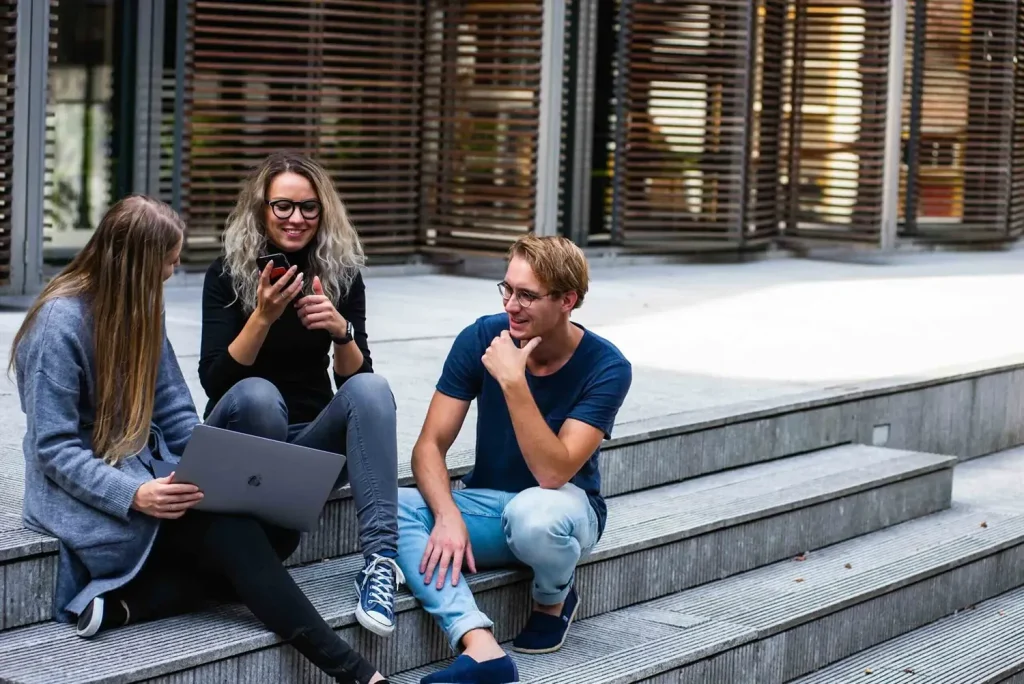 Unistore Scotland - How Much is the Price for a Storage Unit in Scotland - Students Sitting Outside Thinking About Storage